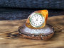 Amber clock on an agate stand