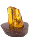 Amber souvenir with inclusion on a stand